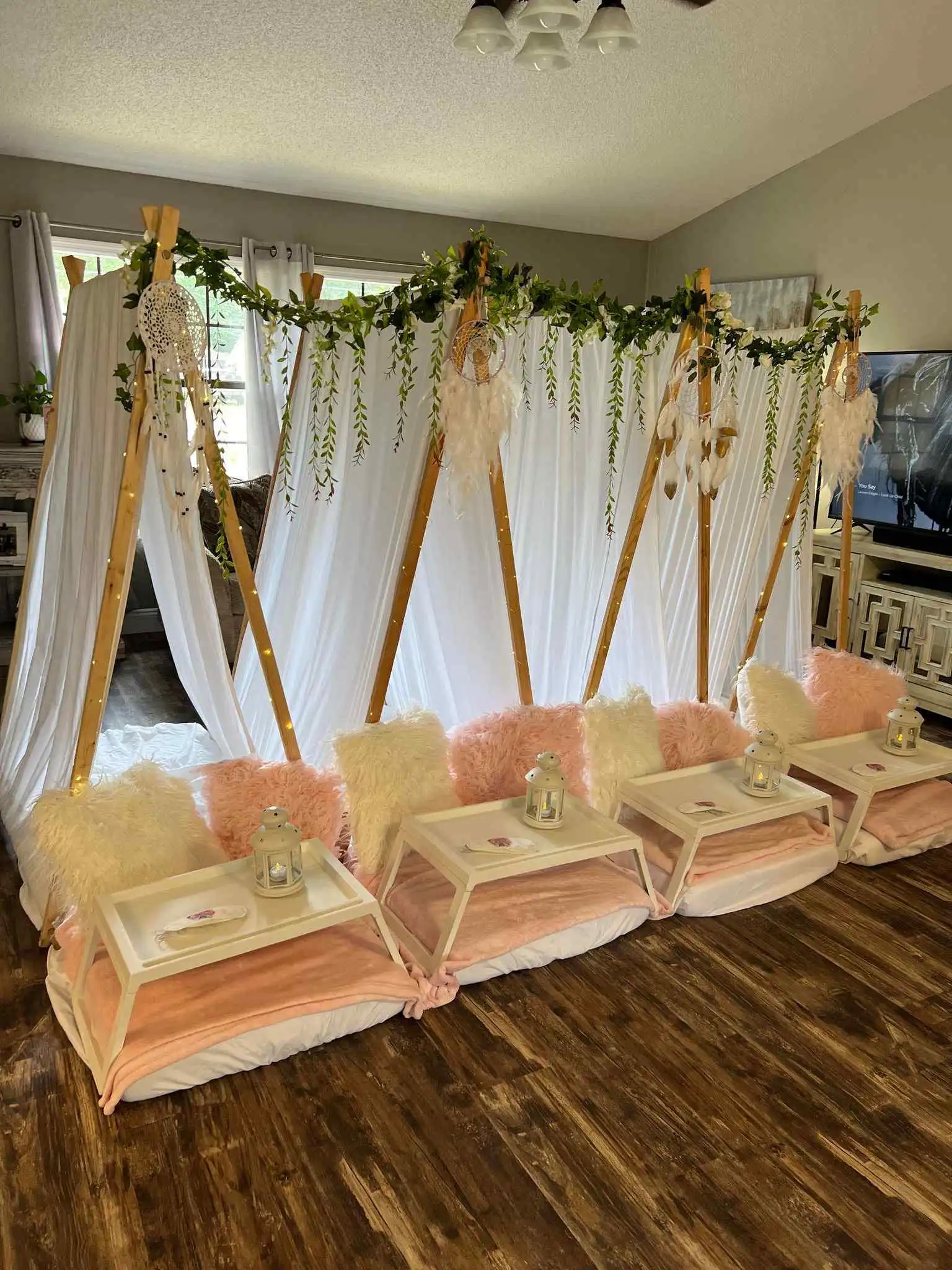 A BeeParty teepee tent set up in a living room.